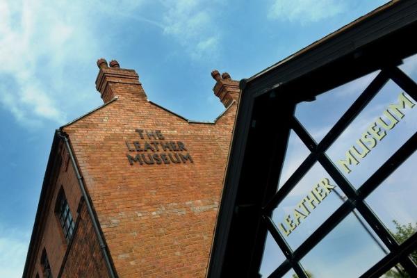 Victorian red brick workshop with a blue sky behind