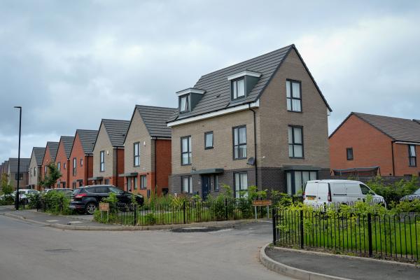 A row of newly built detached brick houses
