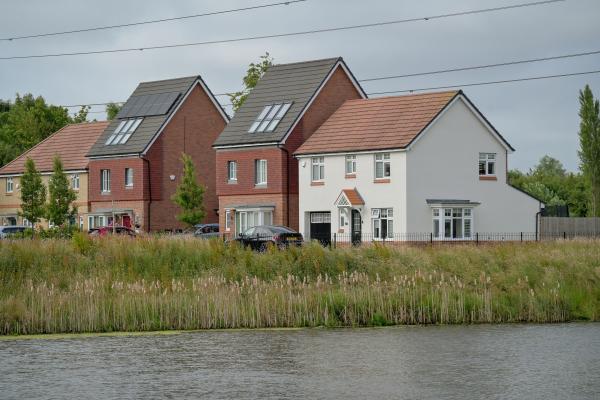 View of newly built houses across a canal