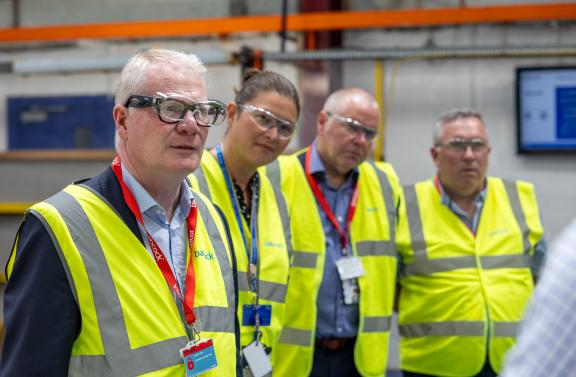 Four people wearing hi-viz vests