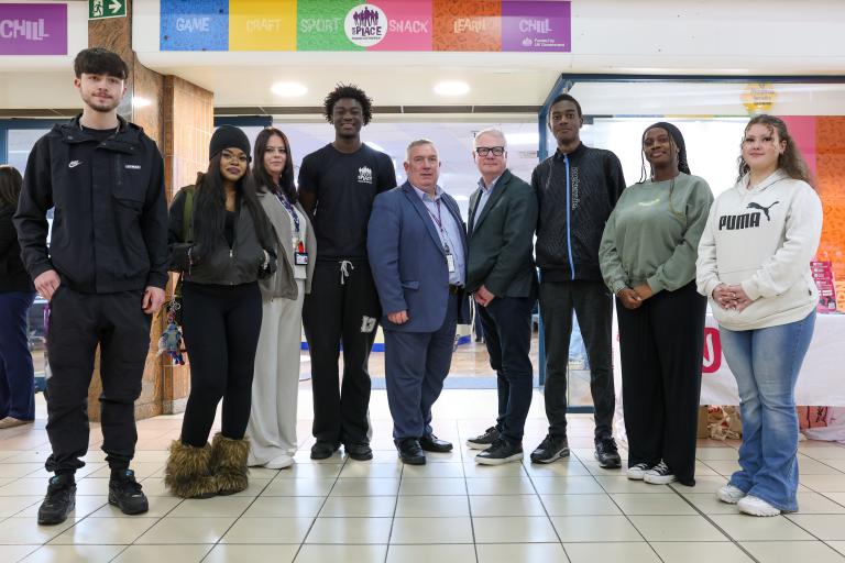 Group of young people outside a shop in Saddler Centre Walsall