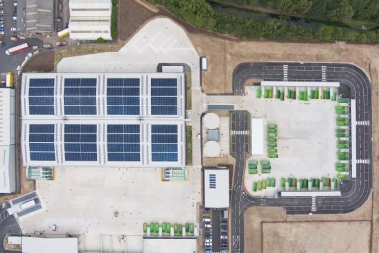 Aerial view of the waste transfer facility showing PV panels on the roof