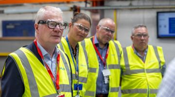 Four people wearing hi-viz vests